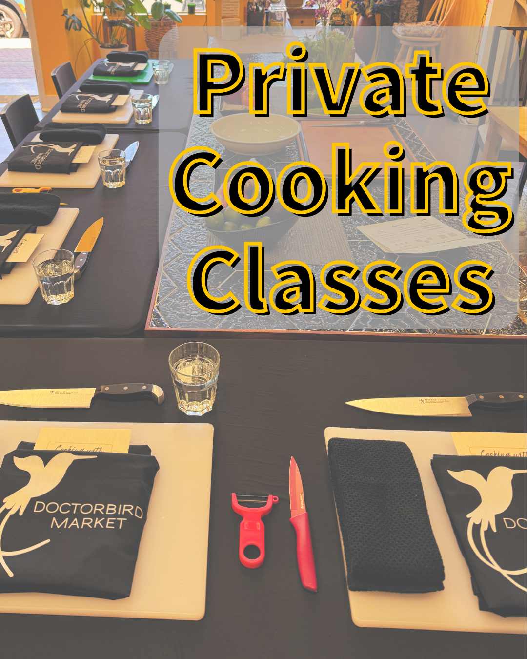 Table setup for private cooking classes with utensils and placemats.